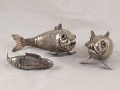 Appraisal: Three white metal tests silver articulated fish being a pair