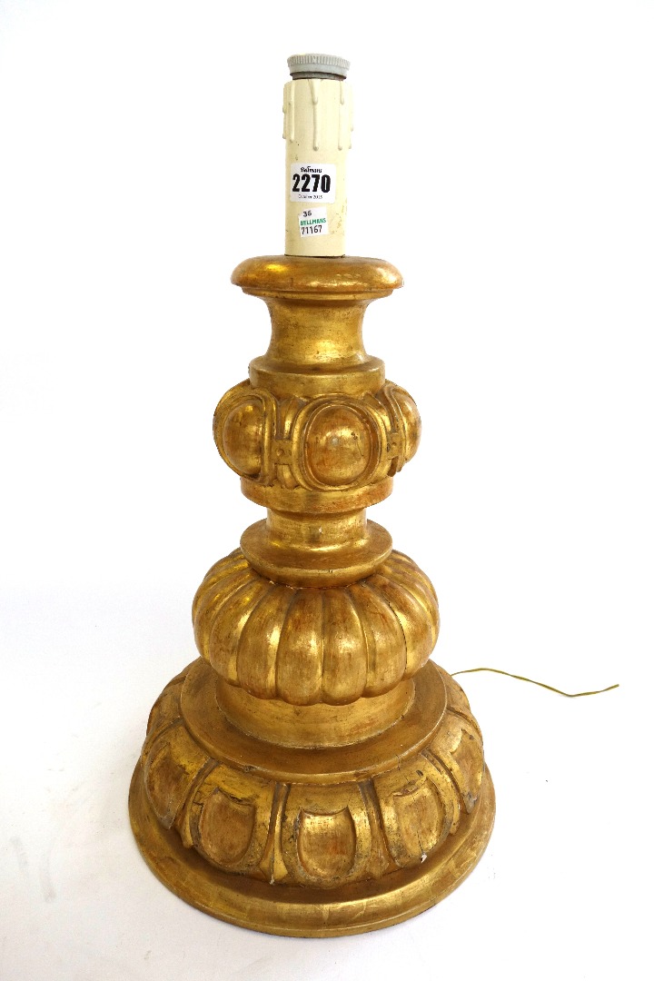 Appraisal: A pair of modern giltwood table lamps each with carved