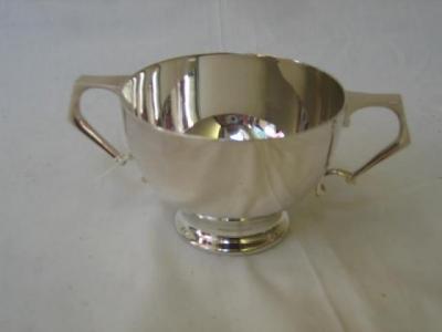 Appraisal: AN EDWARDIAN SUGAR BOWL of circular form with squared loop