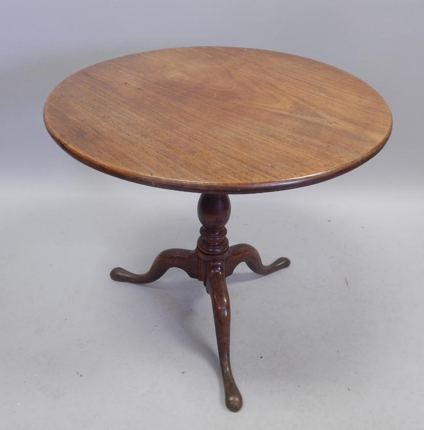 Appraisal: A George III mahogany tilt top table the circular top