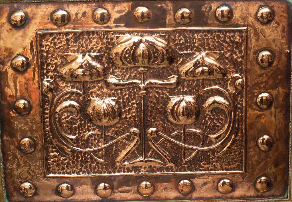 Appraisal: ARTS CRAFTS COPPER PANEL the central field chased with stylised