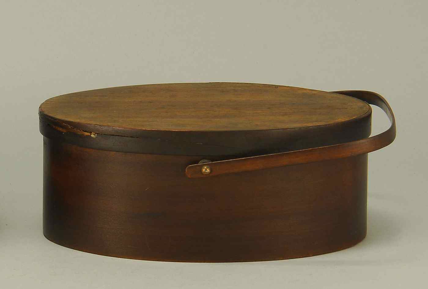 Appraisal: SHAKER THREE-FINGER HANDLED LIDDED BOX th CenturyIn oval form with