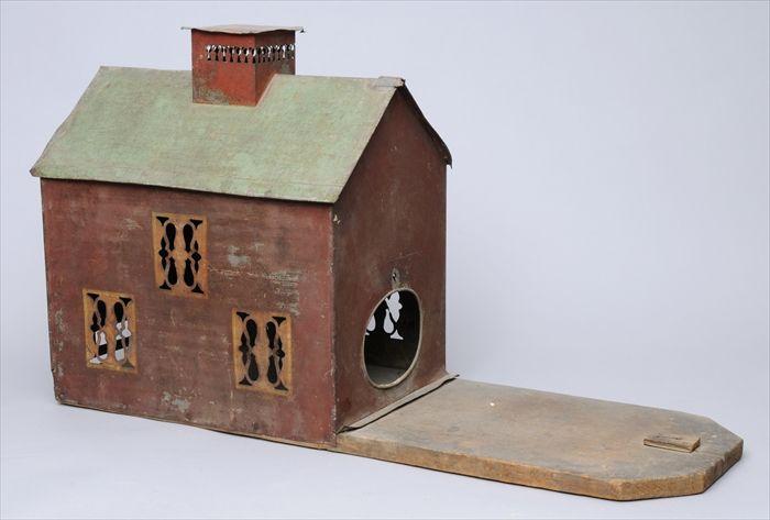 Appraisal: PAINTED TIN BIRD HOUSE With gabled roof center chimney and