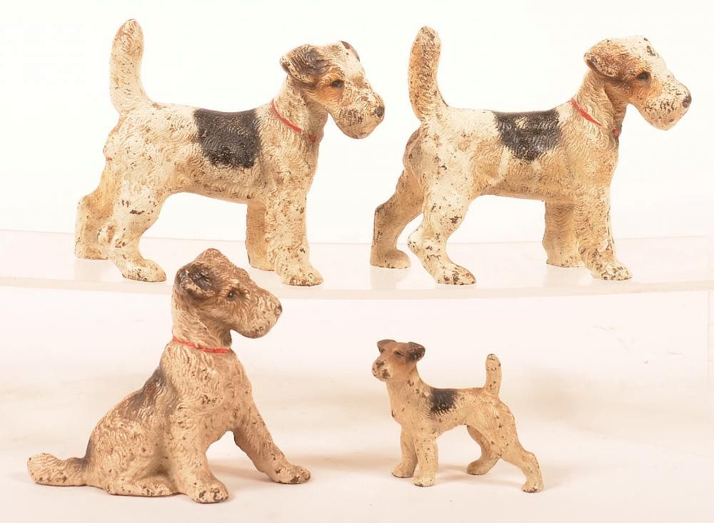 Appraisal: Hubley Wire Haired Fox Terrier Dog Figures Four Various Hubley