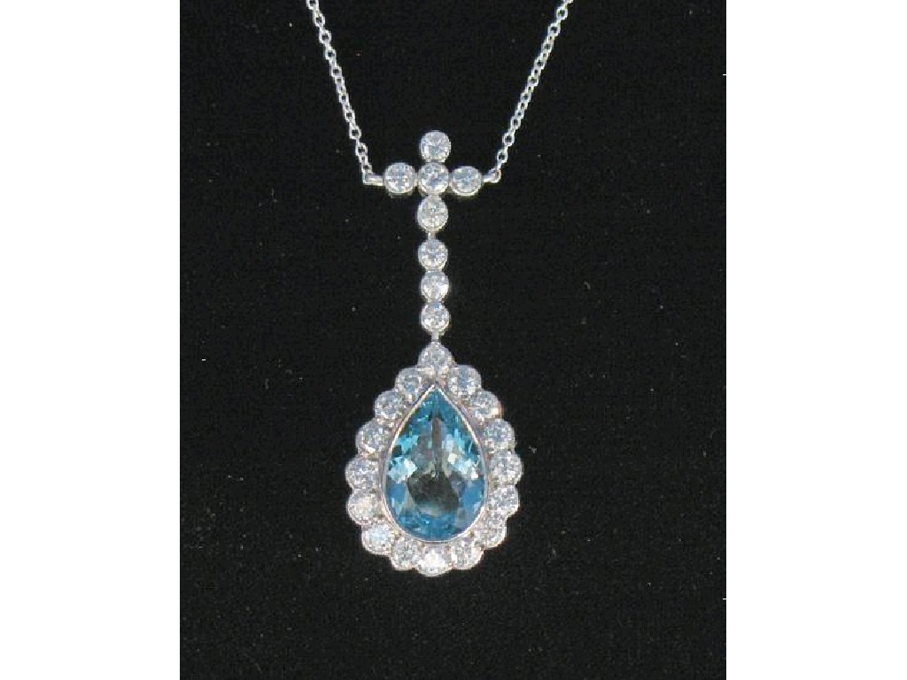 Appraisal: AN AQUAMARINE AND DIAMOND CLUSTER PENDANT the central pear-cut aquamarine