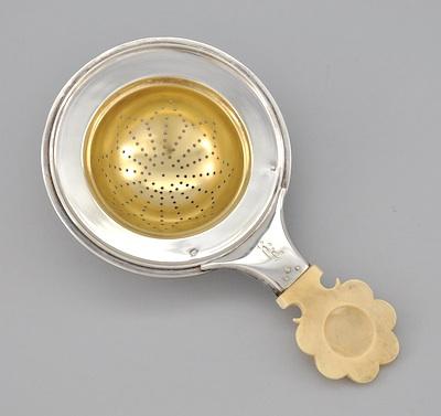 Appraisal: An Austro-Hungarian Silver with Gold Wash Tea Strainer with Ivory