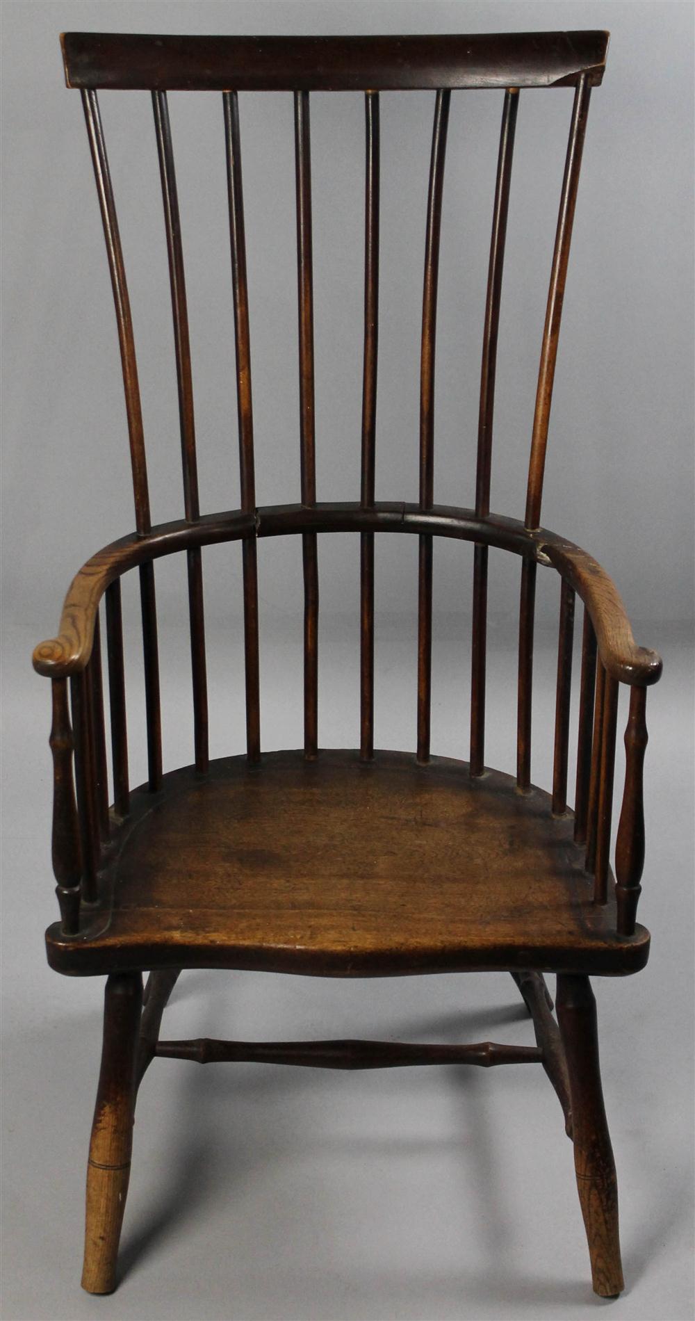 Appraisal: COMB BACK WINDSOR CHAIR of mixed woods having a straight