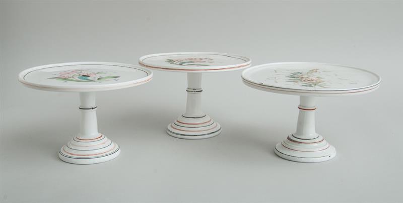 Appraisal: PAIR OF CONTINENTAL TRANSFER-DECORATED MILK GLASS CAKE STANDS AND A