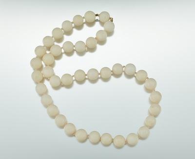 Appraisal: A Strand of White Coral Beads individually knotted mm coral