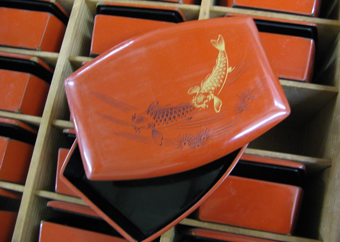 Appraisal: A PINE-CASED SET OF TWENTY-FOUR RED LACQUER SUSHI BOXES Japanese