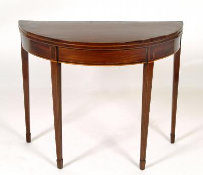 Appraisal: A GEORGE III MAHOGANY FOLDING CARD TABLE of demi lune