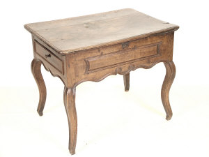 Appraisal: A French fruitwood reading table th century the moulded rectangular