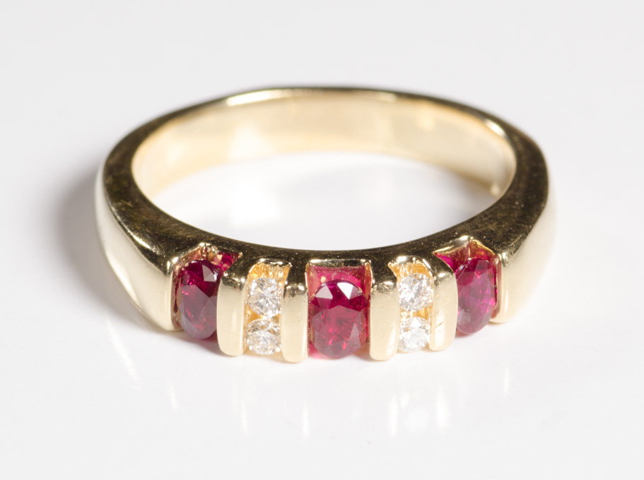 Appraisal: DIAMOND RUBY AND FOURTEEN KARAT GOLD RING set with three