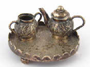 Appraisal: A Chinese miniature silver teapot and bowl on circular tray