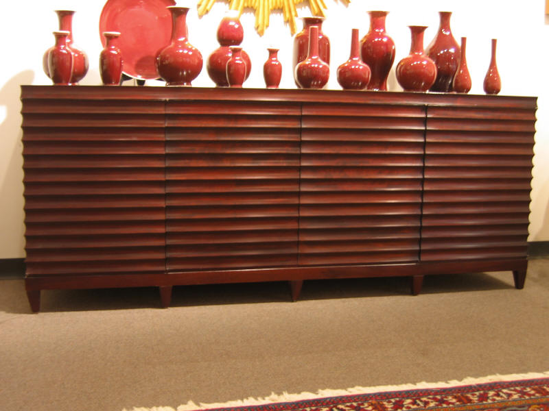 Appraisal: BAKER FURNITURE Mahogany buffet having four louvered doors opening to