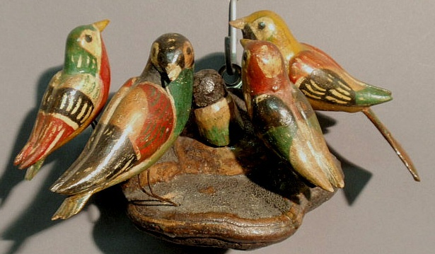 Appraisal: Carved birds on a nest with polychrome decoration late th