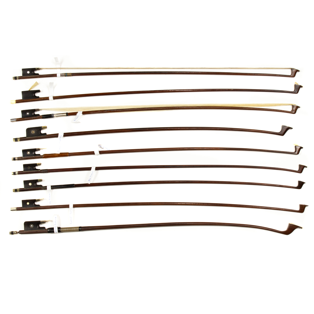 Appraisal: NINE CELLO AND VIOLIN BOWS INCLUDING FRENCH AND GERMAN EXAMPLES