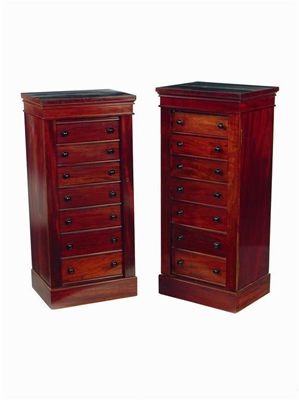 Appraisal: A matched pair of mahogany Wellington chests both with seven