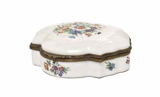 Appraisal: A Continental Porcelain Table Casket the hinged lid centered with