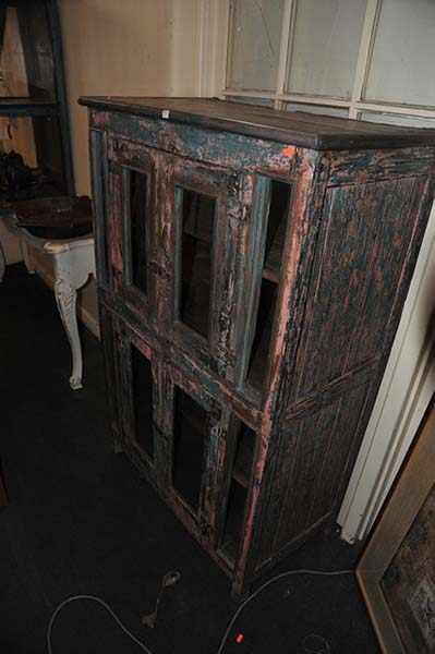 Appraisal: A DISTRESSED BLUE AND PINK PAINTED CABINET WITH METAL FITTINGS