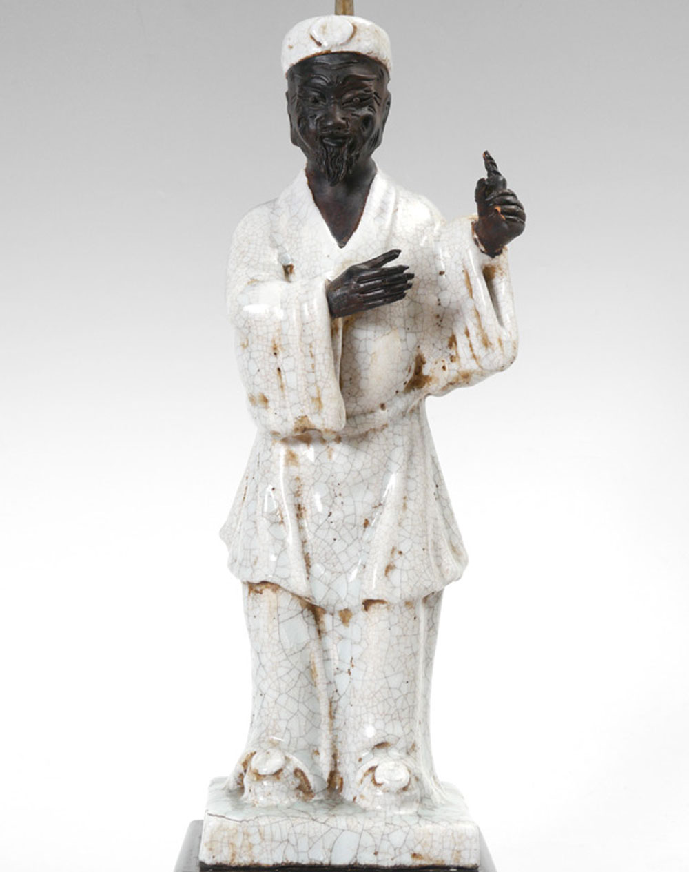 Appraisal: CHINESE CRACKLE GLAZE FIGURAL LAMP Terracotta figure of a man