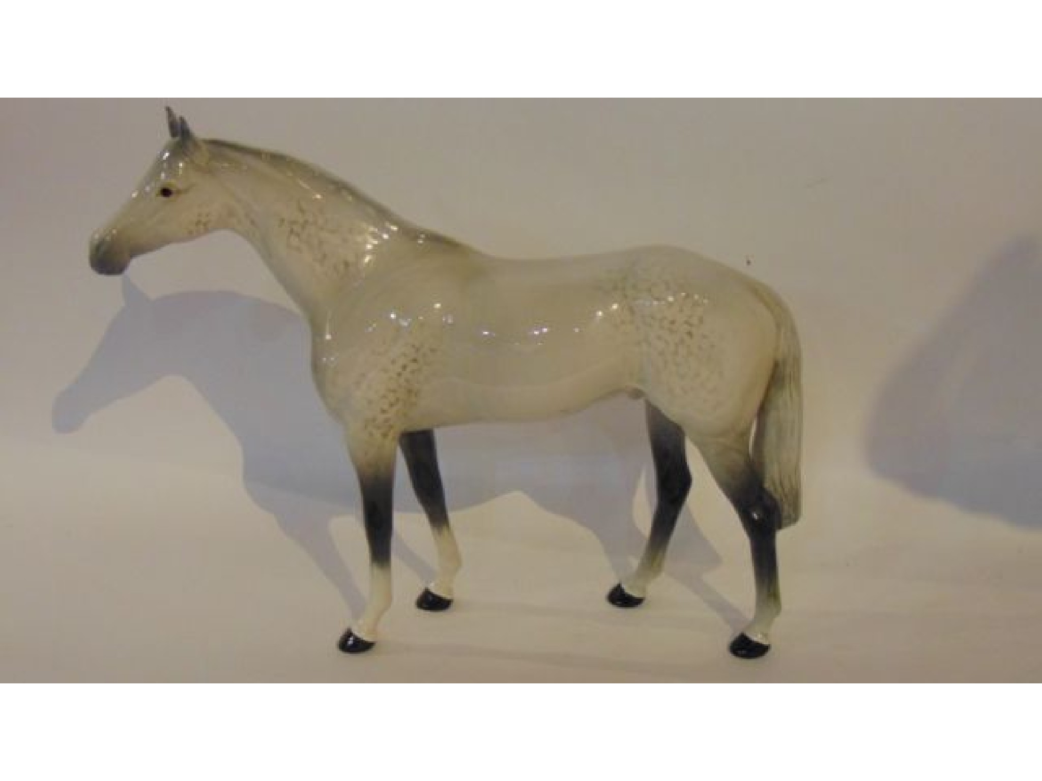 Appraisal: A large Beswick model of a standing grey horse with