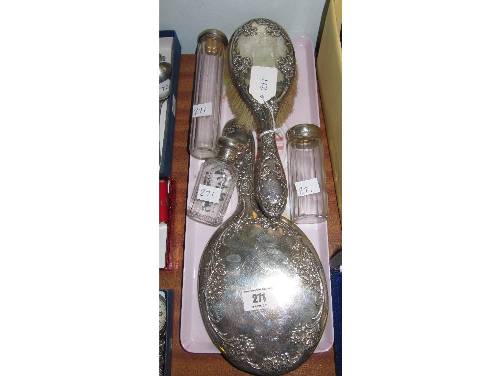 Appraisal: Lot comprising silver brush and mirror and three silver topped