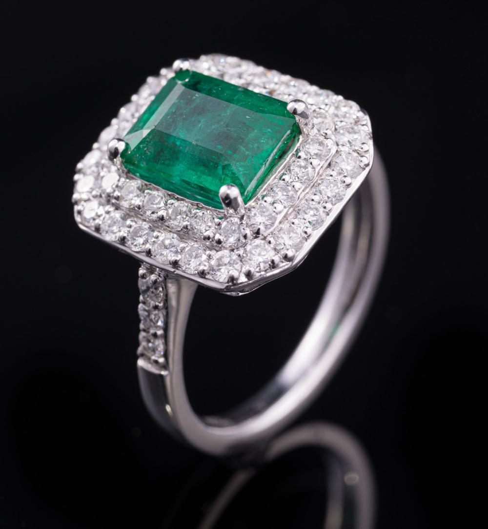 Appraisal: Platinum Emerald and Diamond Ring center prong set rectangular step