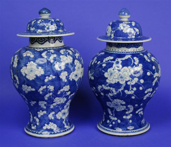 Appraisal: TWO CHINESE BLUE AND WHITE PRUNUS BLOSSOM COVERED BALUSTER VASES