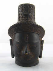 Appraisal: A bronze head with elongated earlobes tiara and plaited hair