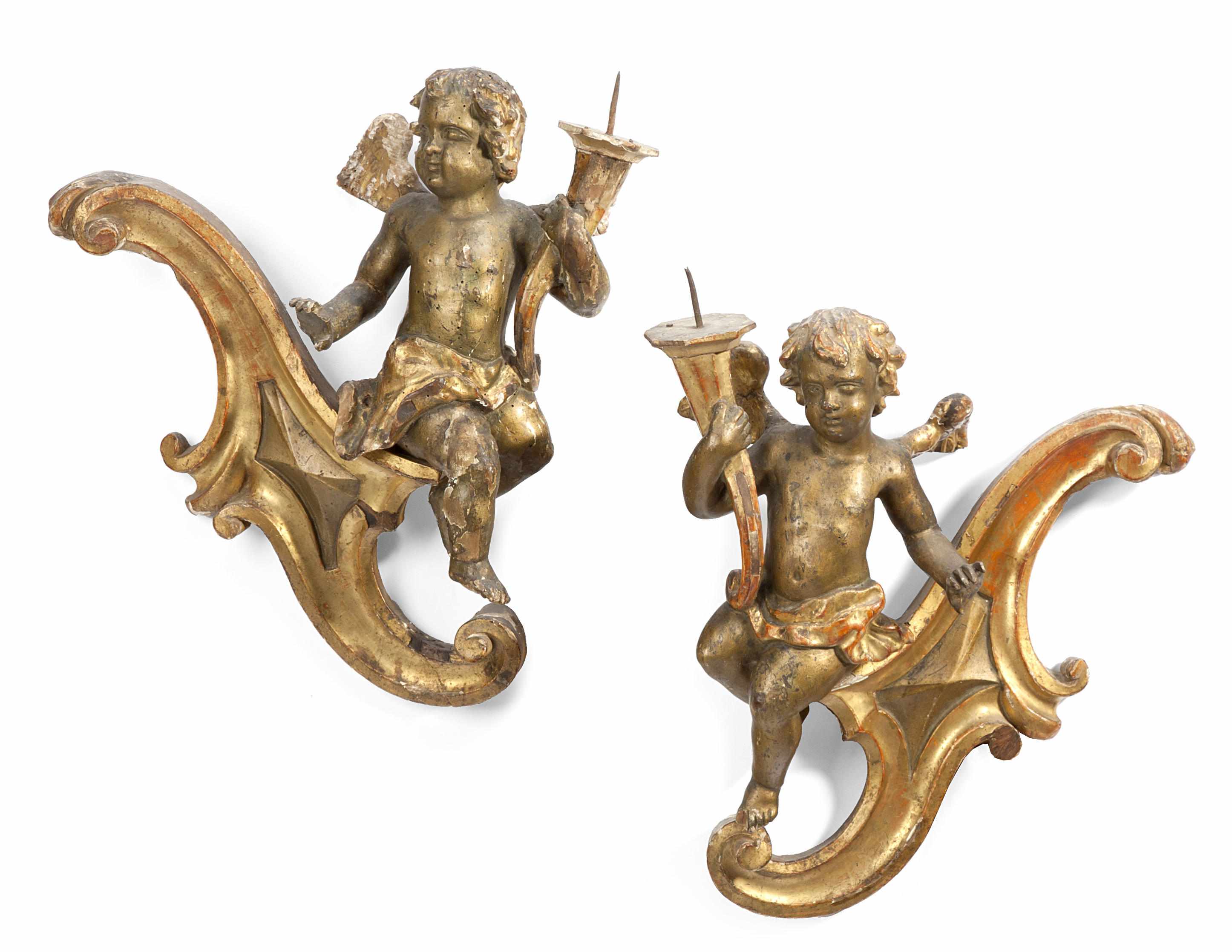 Appraisal: A pair of Italian Rococo giltwood figural wall prickets th