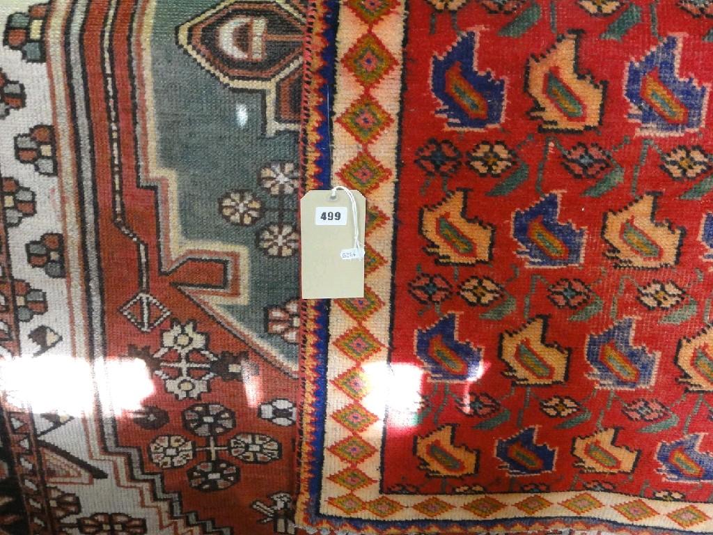 Appraisal: A middle eastern design rug with a central field of