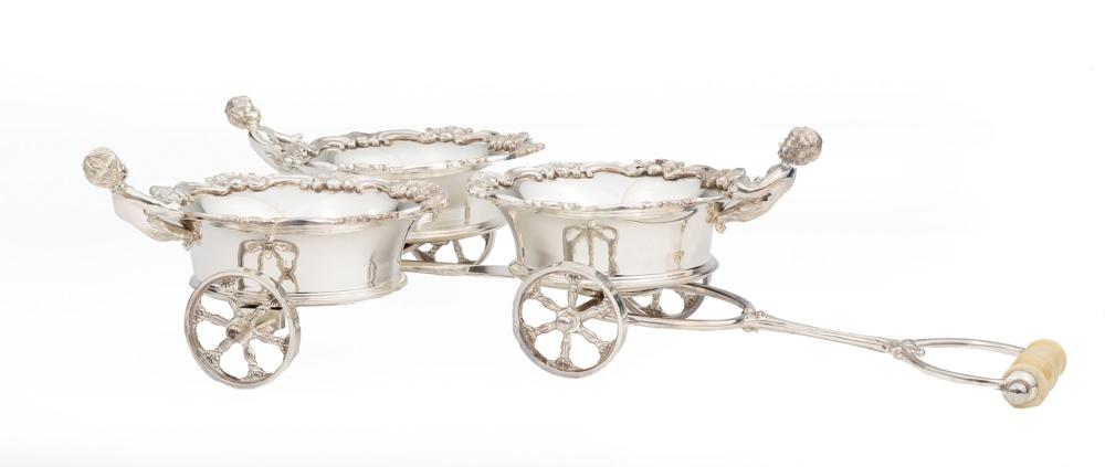 Appraisal: Decorative Silverplate Figural Wine Trolley fitted with three coasters each