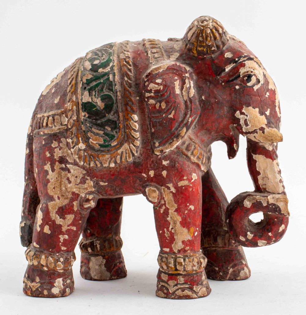 Appraisal: INDIAN POLYCHROME HAND-CARVED WOODEN ELEPHANT Indian polychrome hand-carved wooden elephant