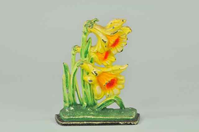 Appraisal: JONQUILS DOORSTOP Hubley cast iron very colorfully painted depiction of