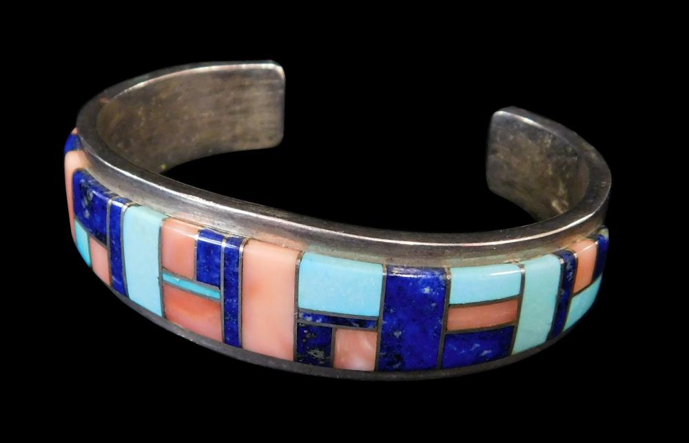 Appraisal: Native American sterling cuff bracelet with raised channel of inset