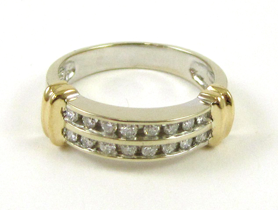 Appraisal: DIAMOND AND FOURTEEN KARAT TWO TONE GOLD RING The white