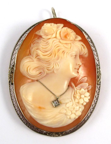 Appraisal: VICTORIAN CAMEO BROOCH an oval portrait of a young woman