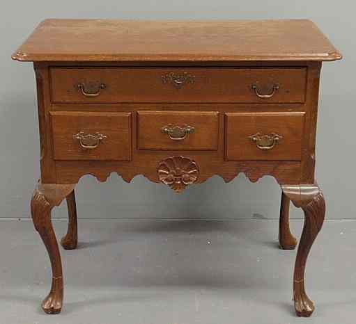 Appraisal: Chippendale style walnut lowboy comprised of period elements with a