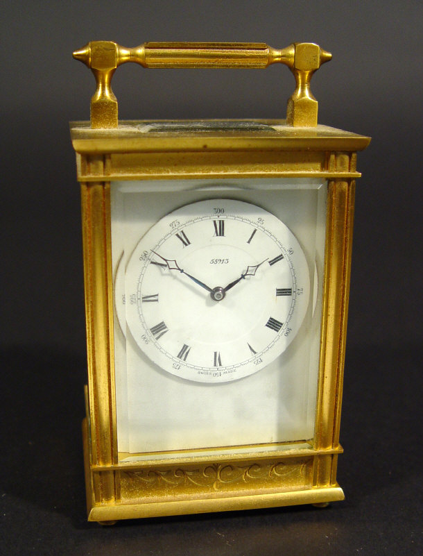 Appraisal: Brass cased carriage clock with bevelled glass panels and enamel