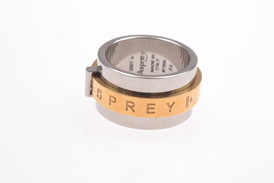 Appraisal: A GOLD KIERA RING BY ASPREY IN STEEL AND CT