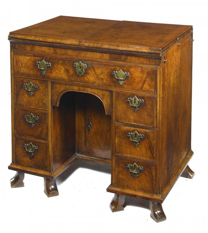 Appraisal: A QUEEN ANNE WALNUT AND FEATHERBANDED KNEEHOLE DRESSING TABLE the