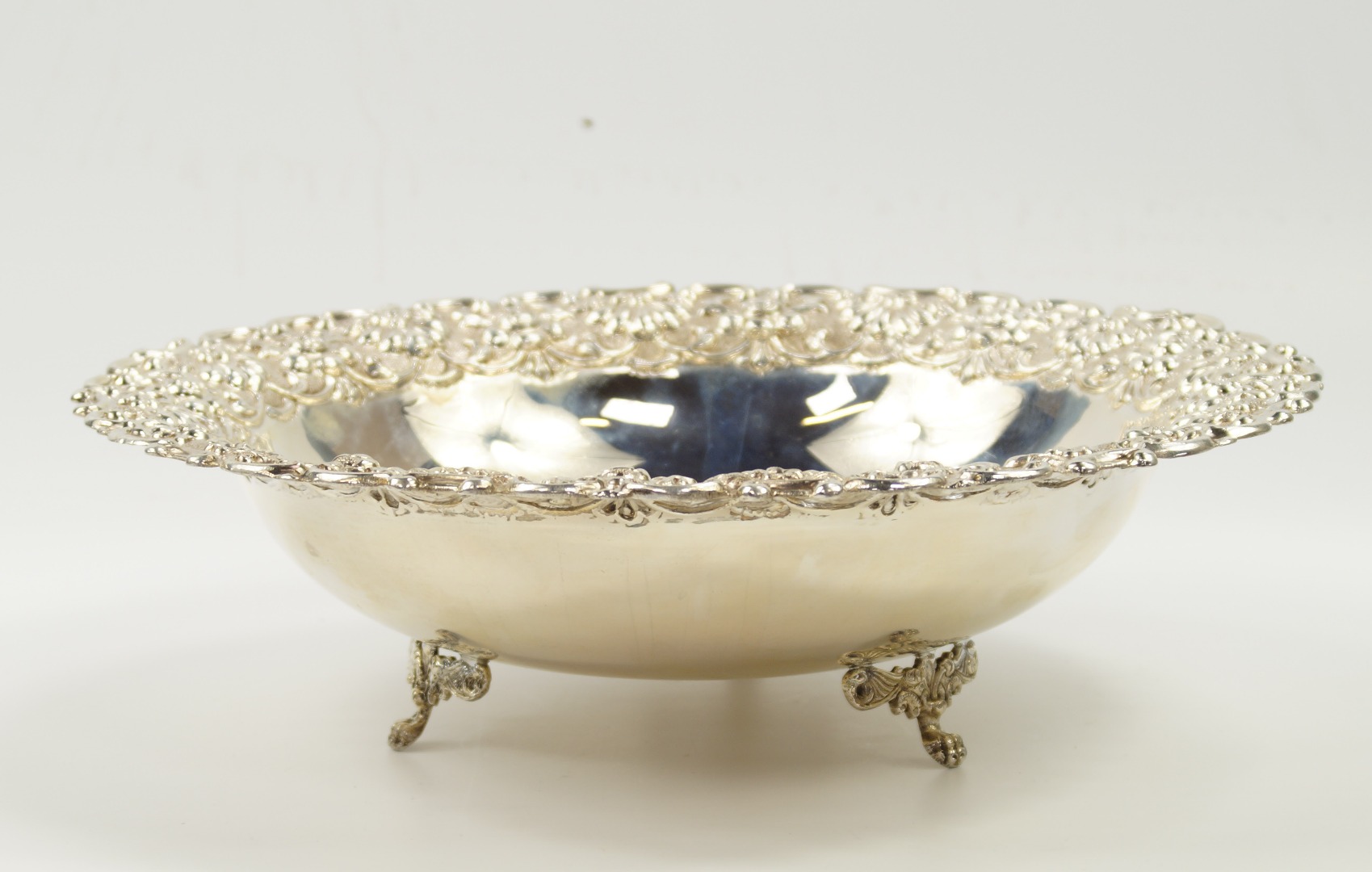 Appraisal: A white metal circular silver dish possibly American embossed with