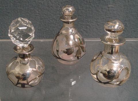 Appraisal: silver overlay scent bottles cracked with replaced stoppers typical height