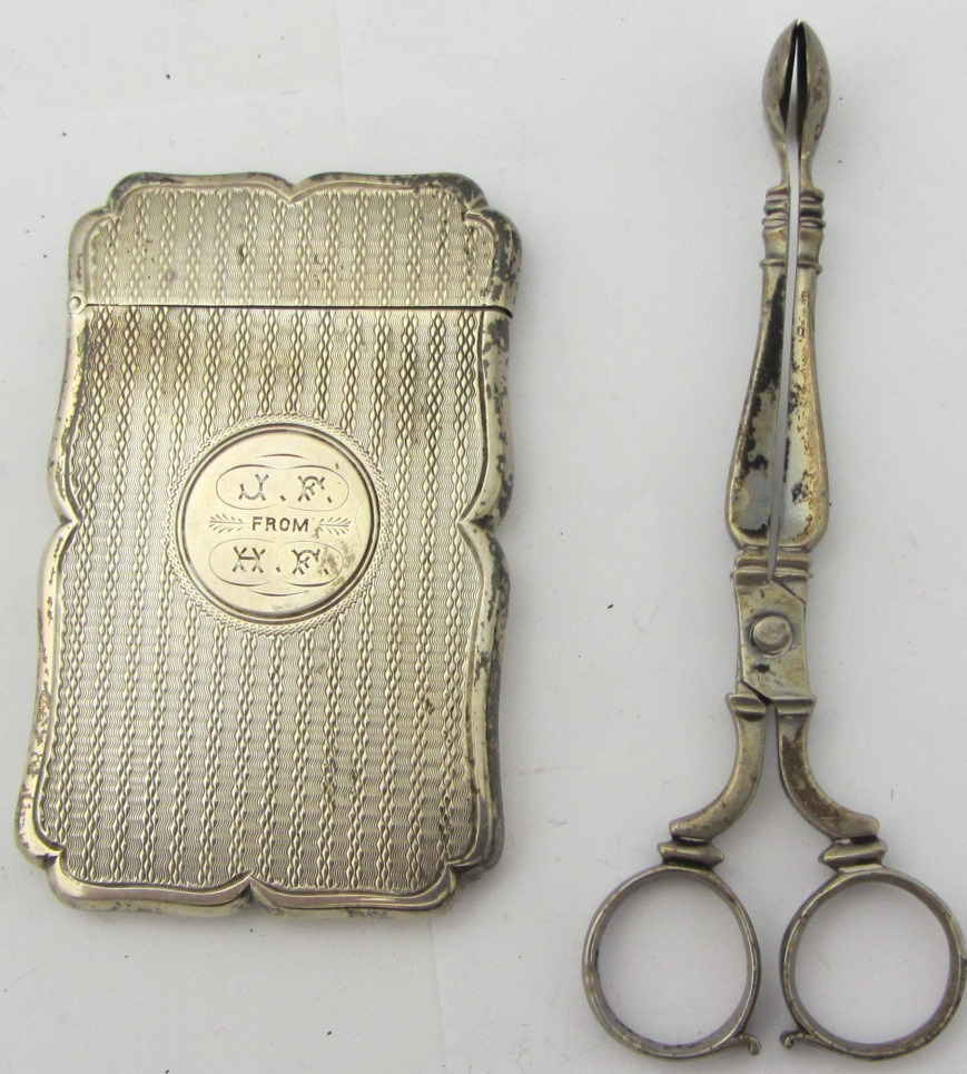 Appraisal: A Victorian silver shaped rectangular visiting card case with engine