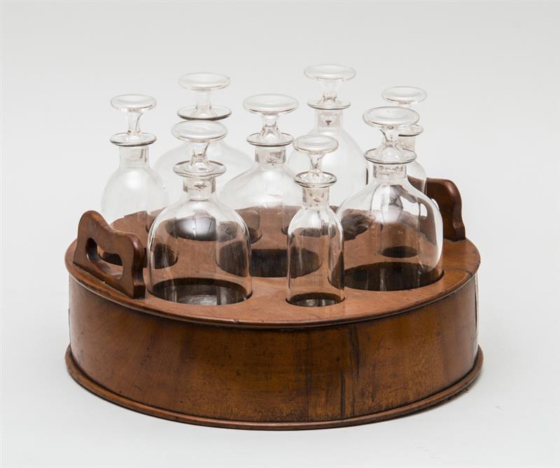 Appraisal: ENGLISH MAHOGANY TWO-HANDLED BOTTLE CADDY FITTED WITH EIGHT CLEAR GLASS