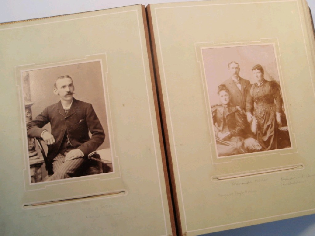 Appraisal: A Victorian leather bound photograph album containing a collection of