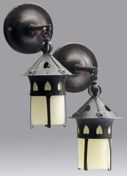 Appraisal: GUSTAV STICKLEY Pair of wrought and hammered copper ceiling lanterns