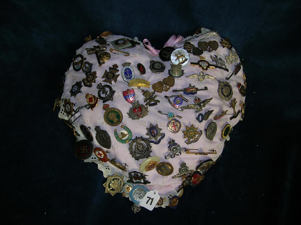 Appraisal: A large collection of sweetheart badges pinned to a heart