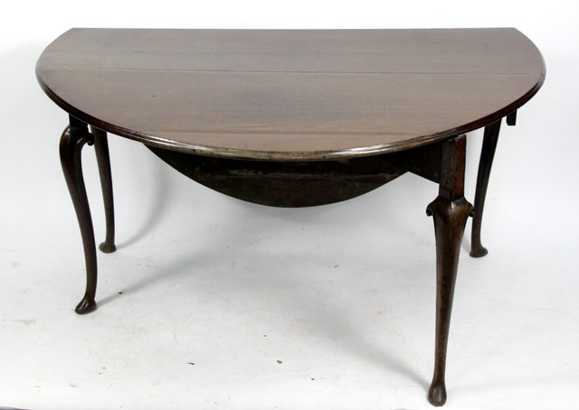 Appraisal: A George II mahogany drop leaf table circa of oval